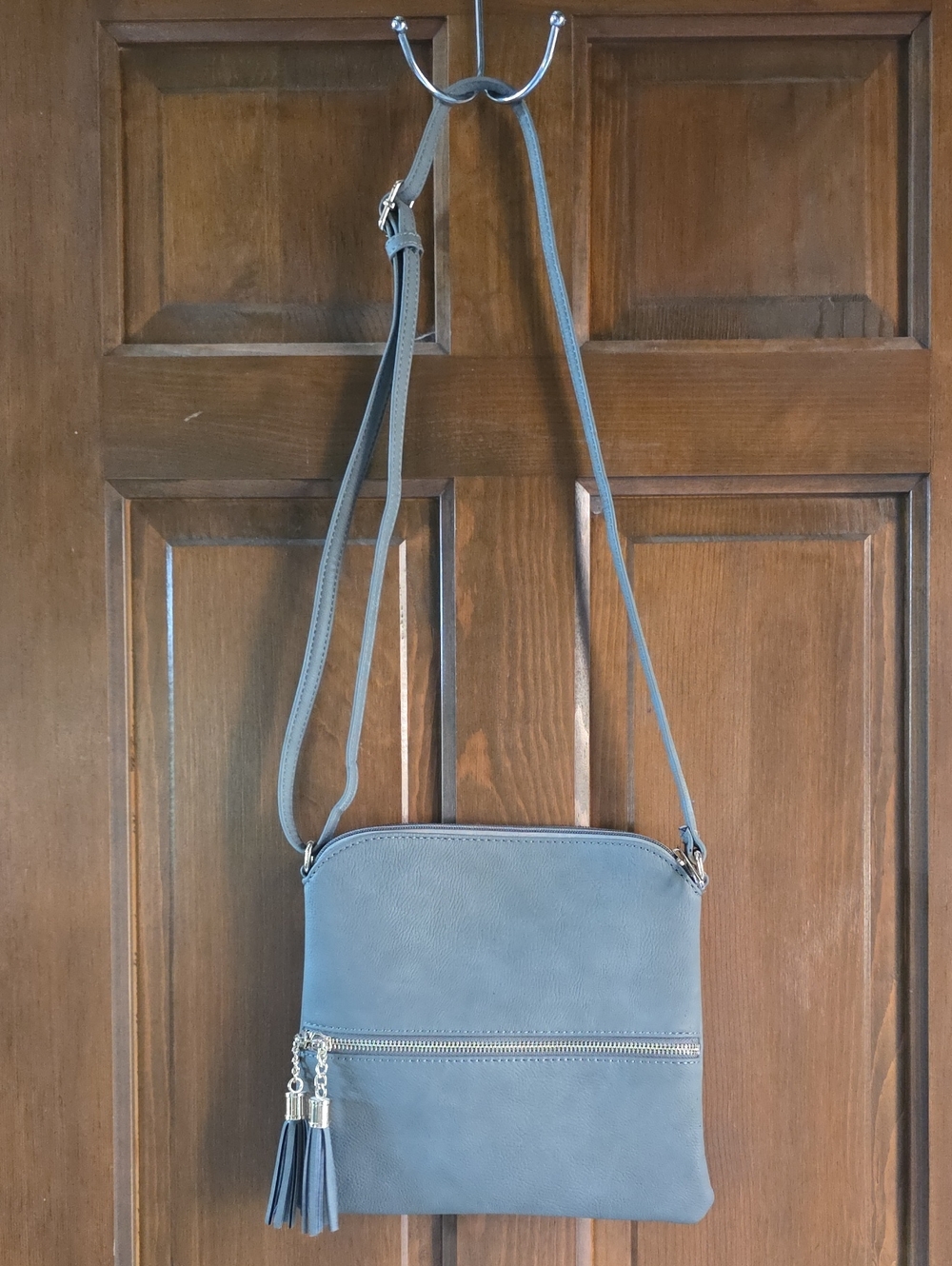 Classic Slate Gray Adjustable Crossbody Bag with Tassel Accents Like New